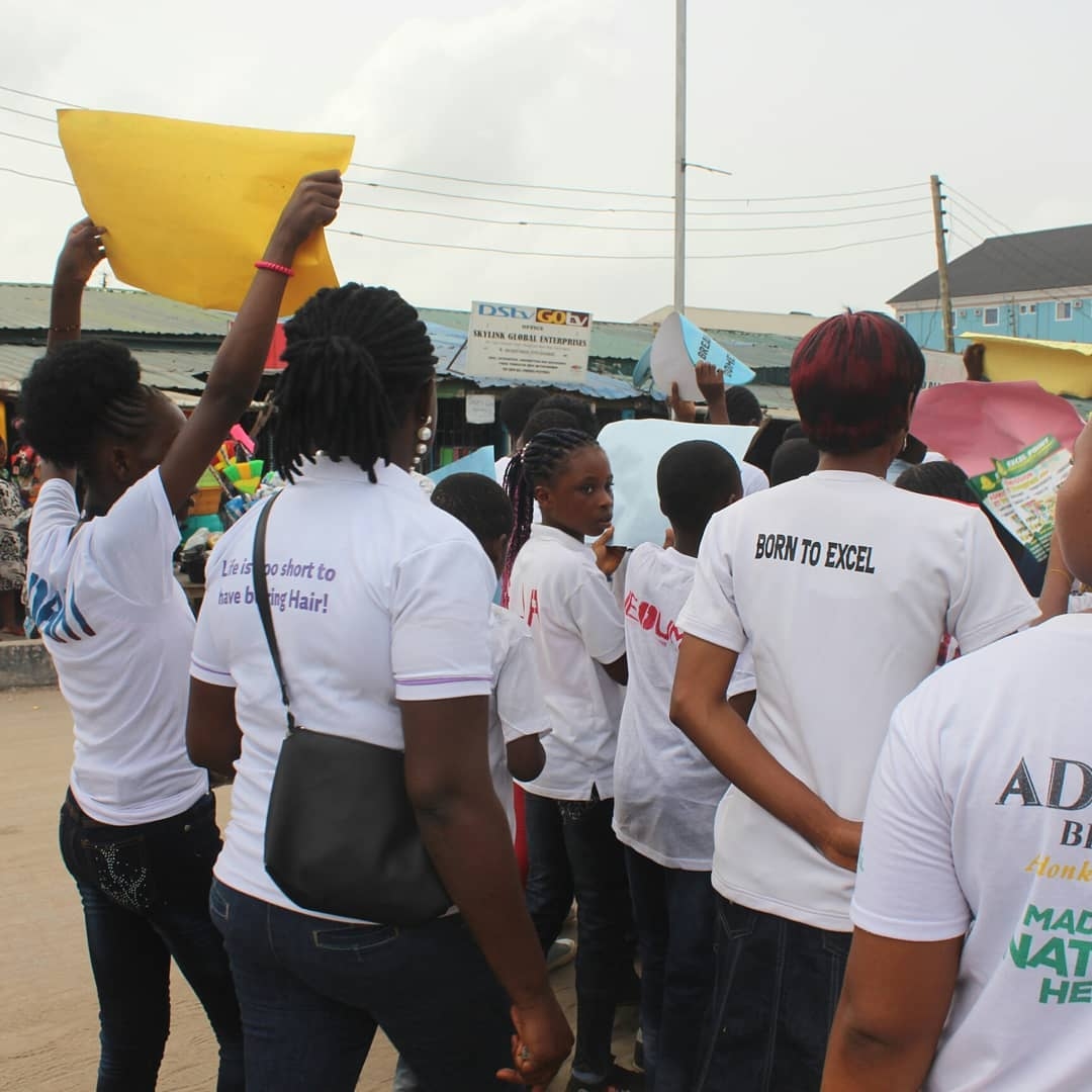 OLIC volunteers and community members marching at an awareness rally in Iba, Lagos